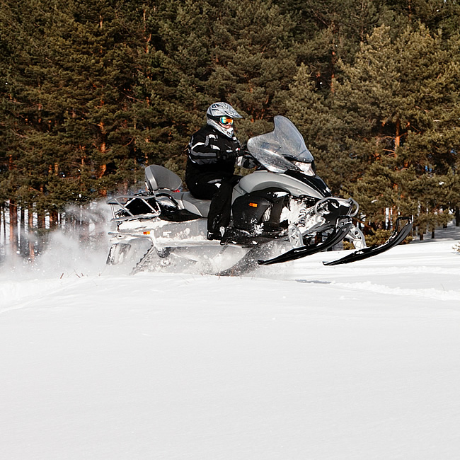 person riding a snowmobile